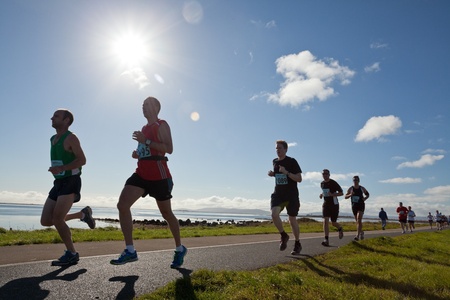 GALWAY, IRELAND - OCTOBER 6: Unidentified athletes compete during annual Galway Bay Half Marathon and 10K, on October 6, 2012 in Galway, Ireland.のeditorial素材