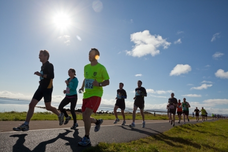 GALWAY, IRELAND - OCTOBER 6: Unidentified athletes compete during annual Galway Bay Half Marathon and 10K, on October 6, 2012 in Galway, Ireland.のeditorial素材