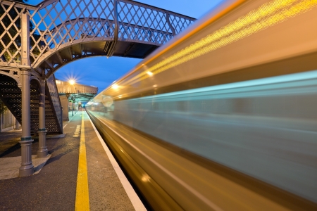 High-speed  intercity train in motion and  Athenry station at night, Irelandの写真素材