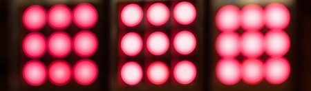 Blurred red lights background in different shapesの写真素材
