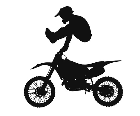 silhouette of freestyle motocross rider jumping through the airの写真素材