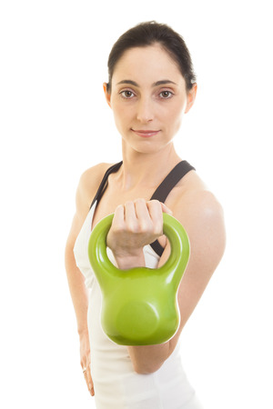 Nice fitness brunette woman working out with waightsの写真素材