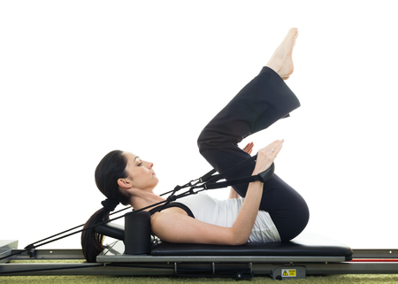 Nice fitness brunette woman working out in the gymの写真素材