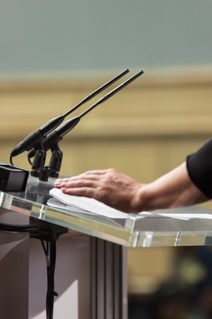 Microphones in busy conference room, shallow DOFの写真素材