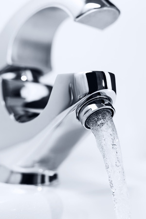 Water flowing out of the tap. Clouse-up, Shallow DOFの写真素材