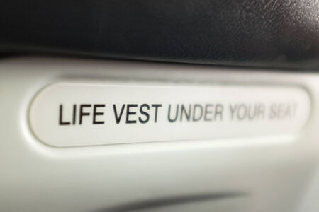 Sign Life West Under the Seat in the airplane. Macro.の写真素材
