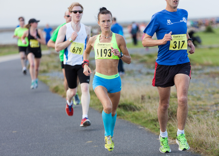 GALWAY, IRELAND - OCTOBER 4: Pauline Curley (1193), 2nd place, compete during annual Galway Bay Half Marathon and 10K, on October 4, 2014 in Galway, Ireland.のeditorial素材