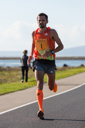 GALWAY, IRELAND - OCTOBER 4: Sergiu Ciobanu, winner, compete during annual Galway Bay Half Marathon and 10K, on October 4, 2014 in Galway, Ireland.のeditorial素材