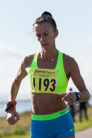 GALWAY, IRELAND - OCTOBER 4: Pauline Curley, 2nd place, compete during annual Galway Bay Half Marathon and 10K, on October 4, 2014 in Galway, Ireland.のeditorial素材