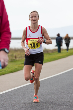 GALWAY, IRELAND - OCTOBER 4: Helen Corbett, 3d place, compete during annual Galway Bay Half Marathon and 10K, on October 4, 2014 in Galway, Ireland.のeditorial素材