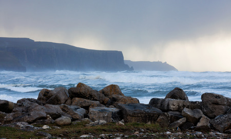 Big waves breaking on cliffs during winter storm on the west coast of Ireland.の写真素材