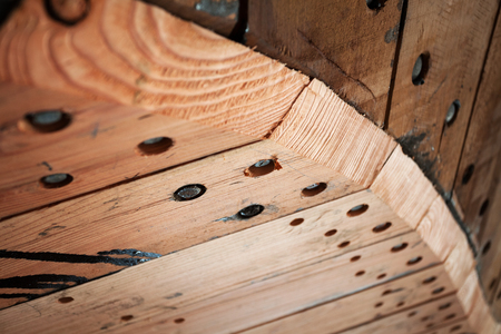 Brown wooden unpainted texture background with knots. Detail. Shallow DOFの写真素材