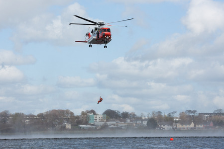 GALWAY, IRELAND - APRIL 12: Irish Coast Guard crew display a water rescue training over Lough Atalia as part of the anual Galway Watersports Show, on April 12, 2015 in Galway, Ireland.のeditorial素材