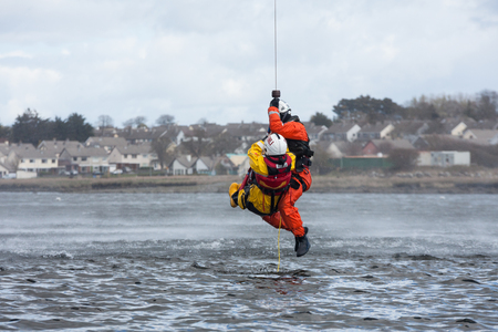 GALWAY, IRELAND - APRIL 12: Irish Coast Guard crew display a water rescue training over Lough Atalia as part of the anual Galway Watersports Show, on April 12, 2015 in Galway, Ireland.のeditorial素材