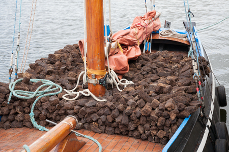 Traditional wooden boat Galway Hooker, loaded with turf.の写真素材