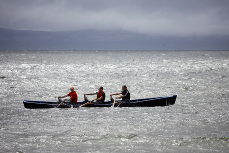 GALWAY - MAY 26: Unidentified athlets compete in All Ireland Currach Racing, during traditional annual An TÃ³stal Festival, on May 26, 2013 in Galway, Ireland.のeditorial素材