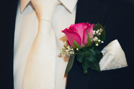 Groom's wedding suite with rose flower buttonhole close upの写真素材
