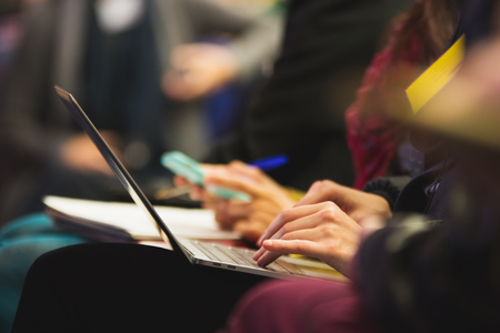 Woman typing on the laptop in conference hall. Detailの写真素材