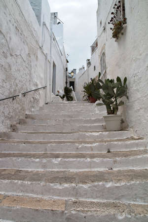 A stare street in Ostuni in Italy. This is a old street in Ostuni in the south of Italy.の写真素材