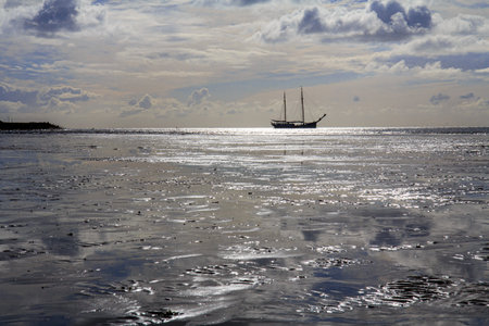 A sail boat in the north of the Netherlands. High quality photo from a ship.の写真素材