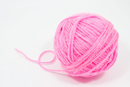 pink yarn on white blackgroundの写真素材