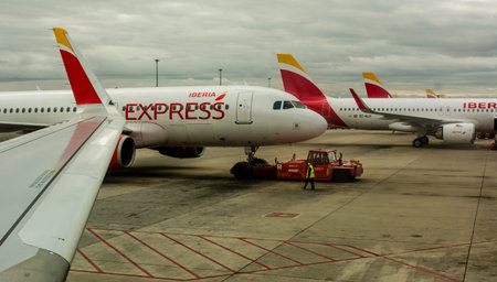 people working at the airport on the runways