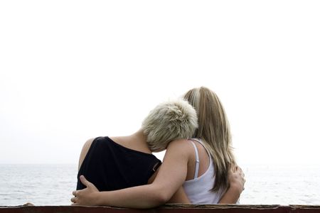 two girls holding eachotherの写真素材