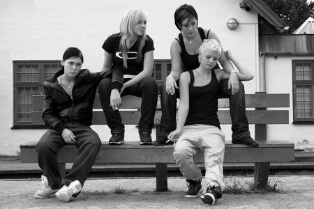 Four girls hanging out looking a little toughの写真素材
