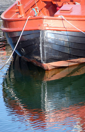                                boat and reflections in the water