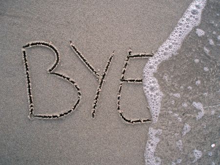 Bye bye written in the sand at the beach   の写真素材