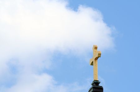 golden cross in the skyの写真素材