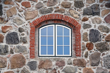 window in a stone built houseの写真素材