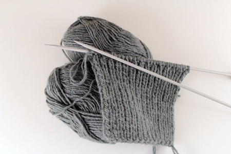 knitting a grey sweaterの写真素材