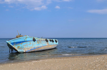 Abandoned migrant boatの写真素材