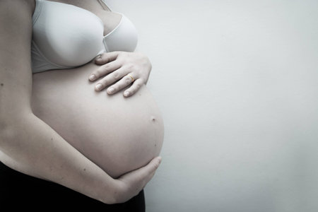 Young mother waiting her babyの写真素材