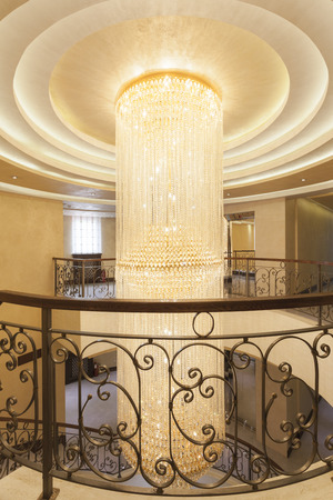 Beautiful crystal chandelier in hotel interiorの写真素材