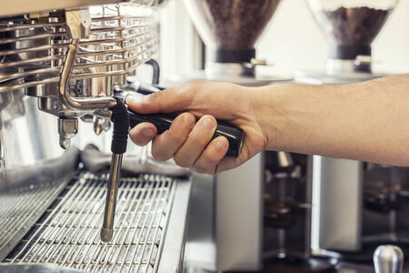 Barista working the coffee machineの写真素材