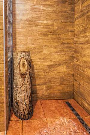 Wooden shower cabin with wooden logの写真素材