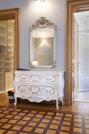 Vintage cabinet and mirror in fancy room interiorの写真素材