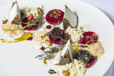 Feta cheese in vine leaves with ground salmonの写真素材