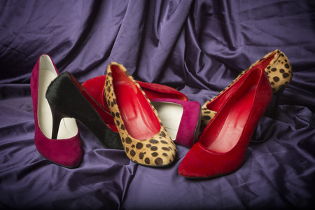 HIgh heel shoes on silk clothの写真素材