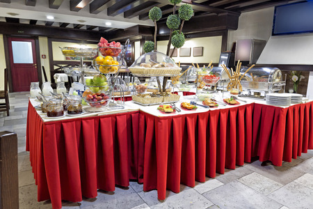 Hotel breakfast served on buffet tableの写真素材