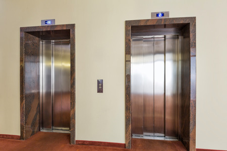 Two elevators in a modern buildingの写真素材