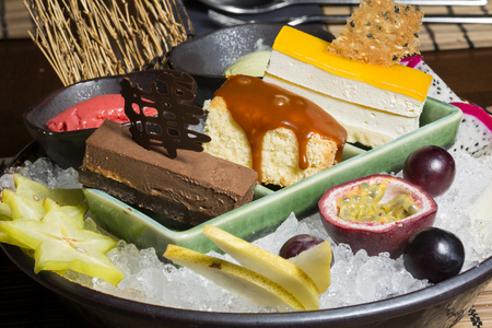 Assorted fruits and desserts served on ice in oriental restaurantの写真素材