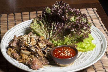 Beef and shitake stir fry with hot and sweet sauceの写真素材