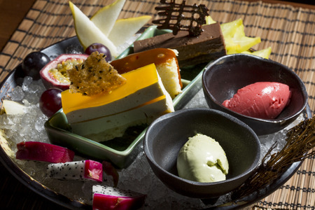 Assorted fruits and desserts served on ice in oriental restaurantの写真素材