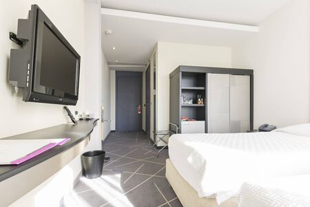 Interior of a double hotel bedroom in the morningの写真素材