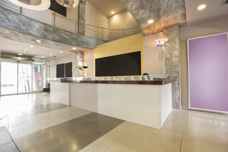 Modern building lobby with reception deskの写真素材