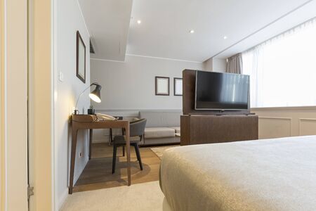 Modern bedroom interior in hotel apartment