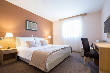 Modern beautiful hotel bedroom interiorの写真素材